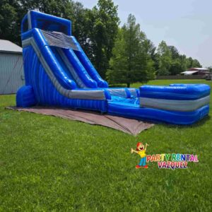 Large blue water slide inflatable rental in Columbus, Indiana, set up for backyard birthday parties, summer events, and family fun