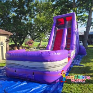 Bright purple inflatable water slide rental in Columbus, Indiana, ideal for outdoor events, kids parties, and unforgettable celebrations.