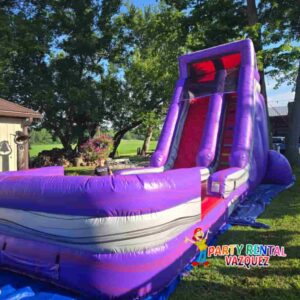 Large purple water slide inflatable rental set up for a party in Columbus, Indiana, offering safe and exciting water fun for children and families.