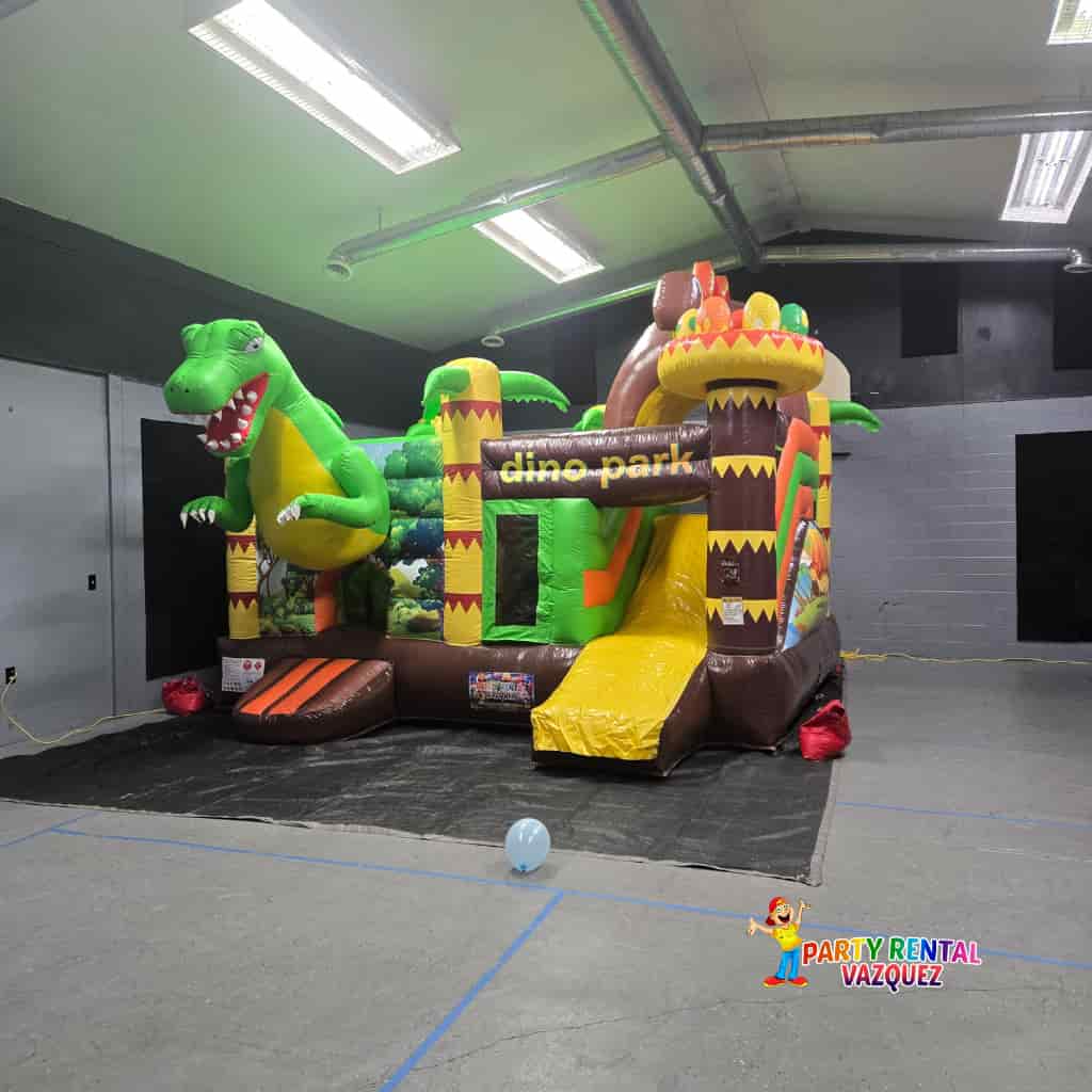 Inflatable Dino Park bounce house with dual slides for kids party rental in Columbus Indiana by Party Rental Vazquez, colorful dinosaur themed jumper for birthdays and events.