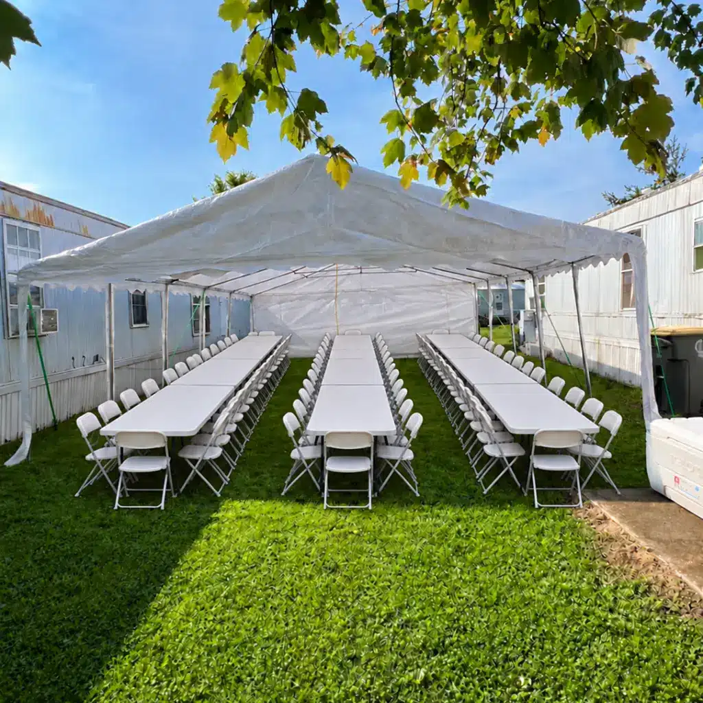 20x32 party tent rental with 9 long tables and 72 chairs for graduation parties and large family gatherings in Columbus, Indiana