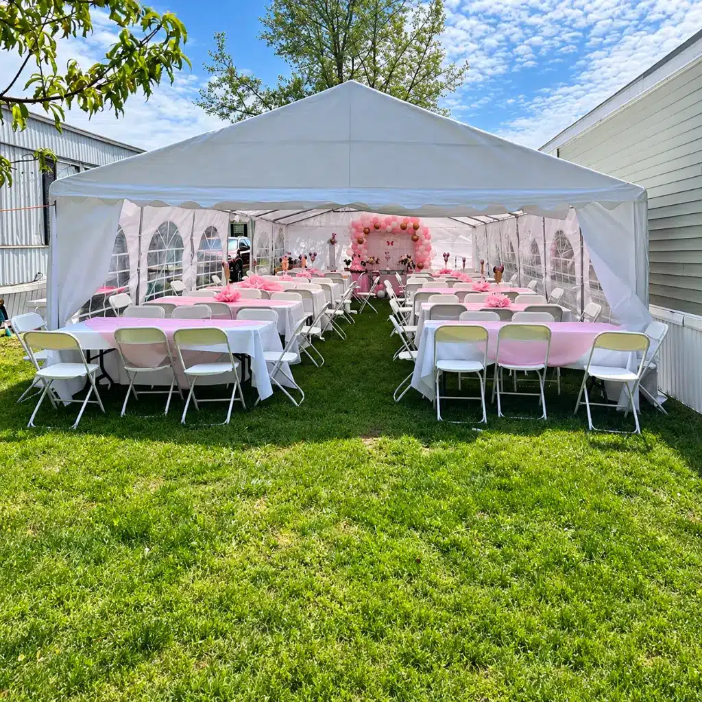 20x40 party tent rental with 12 long tables and 96 chairs for large graduation parties, reunions and community events in Columbus, Indiana